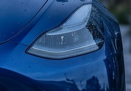 Native crop of the actual product lights-off base, at the vehicle-left headlamp.