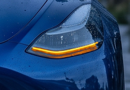 The same base crop composited with the actual turn-signal asset at full layer gain.